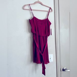 This Gianna Mini Cocktail Fit and Flare Tie Front Pleats Neck Dress